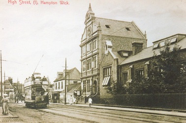 A tram passes the Local Board Offices and Endowed School.